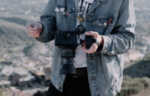 A Person Loading portra 400 film into a mamiya medium format camera