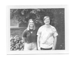 A couple smiling taken on Fujifilm FP-100b black and white Pack Film.
